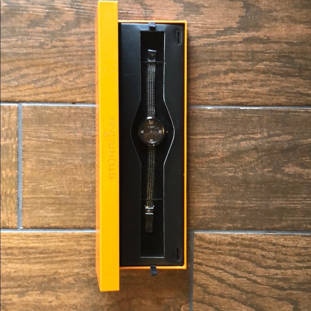 Stuhrling black watch. Never used in original box.